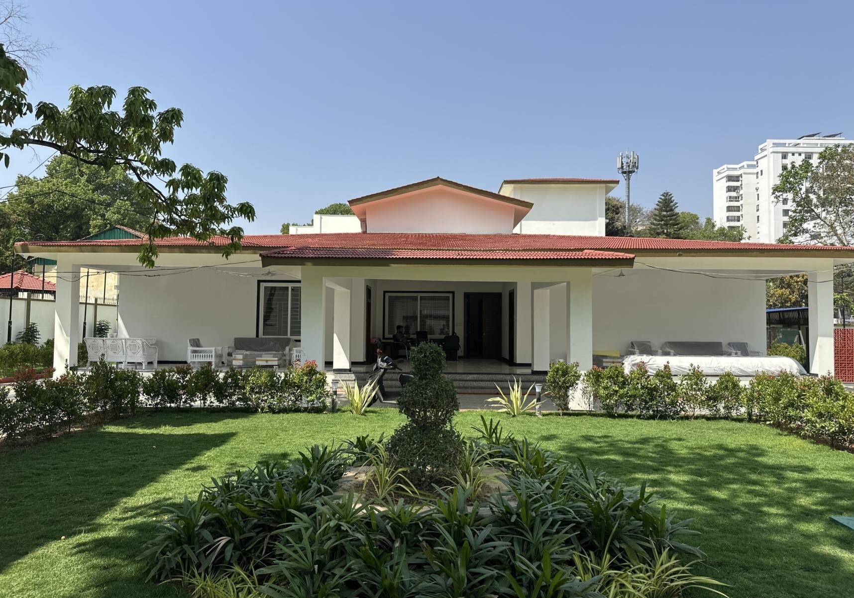 Twin Bungalows residence with red conical roofs, Ranchi