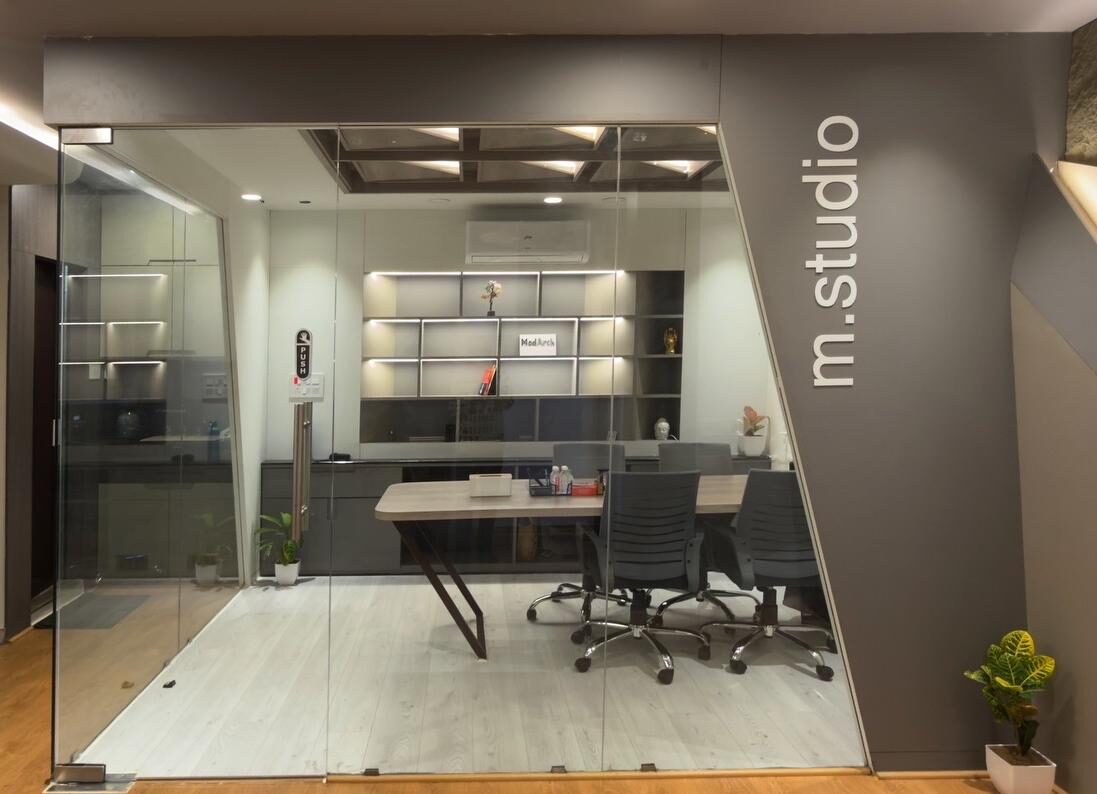 Modarch Office glass wall with m.studio signage