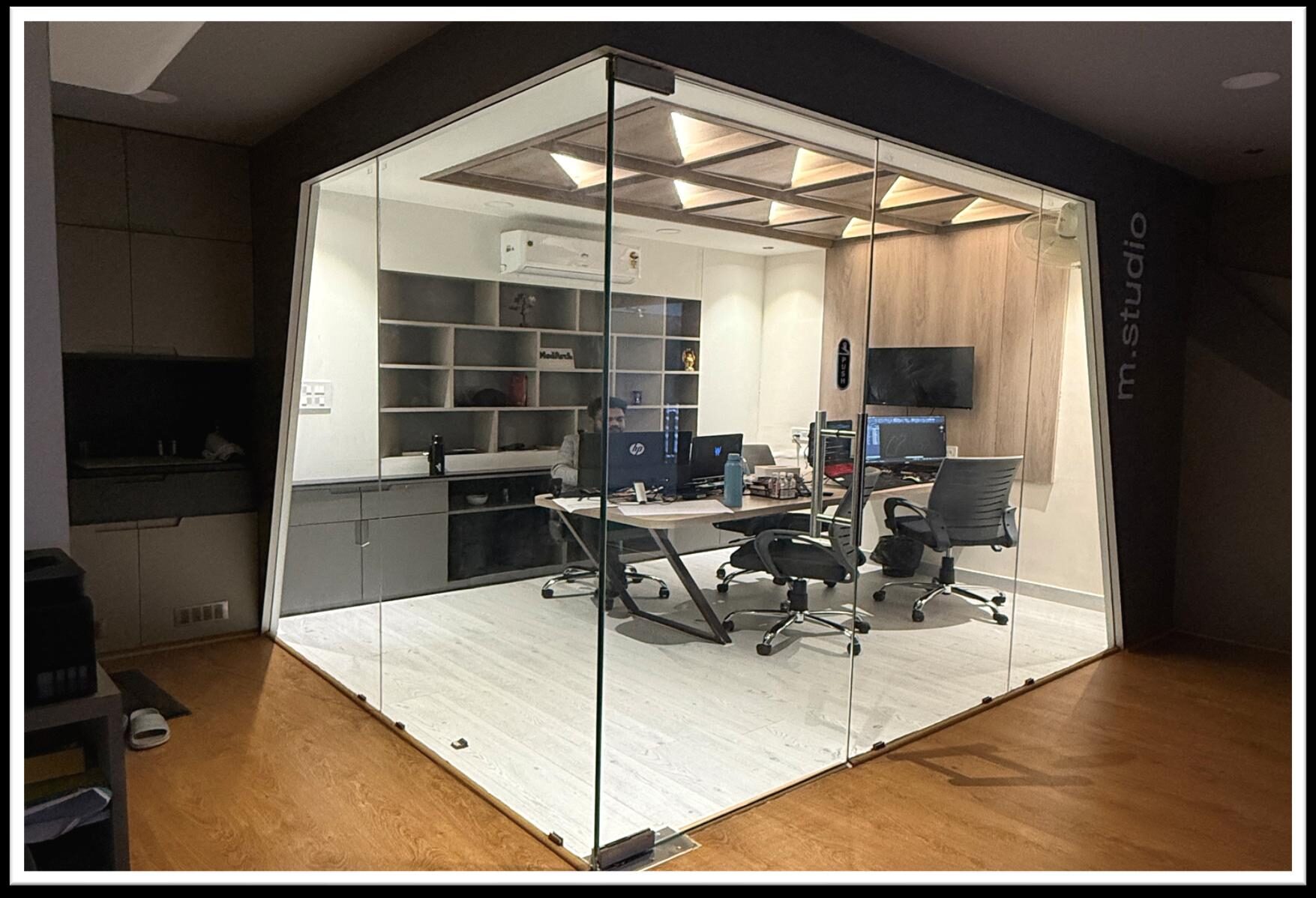 Modarch Studio's own glass-enclosed office interior